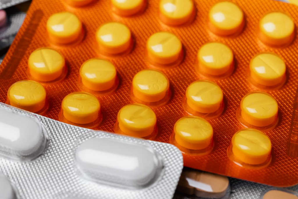 An image shows a detailed close-up of various colorful blister packs.