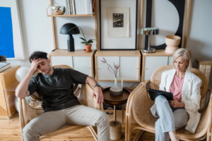This photo shows a man with a therapist.